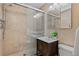 Bathroom featuring a glass-enclosed shower, modern vanity, and tile flooring at 2461 Yates St, Denver, CO 80212
