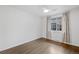 Bright, spacious bedroom features hardwood floors, a window, and modern finishes at 2461 Yates St, Denver, CO 80212