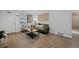 Cozy living room featuring hardwood floors, stylish furniture, and ambient lighting at 2461 Yates St, Denver, CO 80212