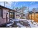 Fenced backyard with patio and detached garage at 2651 Perry St, Denver, CO 80212