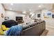 Relaxing basement with a comfortable leather couch and a large beanbag chair near the television at 8863 Osceola St, Westminster, CO 80031