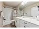 Bright bathroom featuring a shower and tub combo, a vibrant curtain and white vanity with modern fixtures at 8863 Osceola St, Westminster, CO 80031