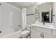 Bright bathroom with white tile, modern vanity, and sleek fixtures for a clean and contemporary feel at 8863 Osceola St, Westminster, CO 80031