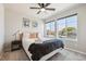 Cozy bedroom with two large windows, light gray walls, and neutral carpet provide a welcoming space at 8863 Osceola St, Westminster, CO 80031