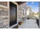 Welcoming front porch with a cozy seating area, perfect for relaxing and enjoying the neighborhood at 8863 Osceola St, Westminster, CO 80031