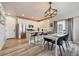 Modern kitchen with stainless steel appliances, white cabinets, and a stylish island with bar seating at 8863 Osceola St, Westminster, CO 80031