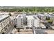 Overhead view showcasing modern buildings with rooftop AC units, nestled within a community featuring lush green spaces at 1898 S Bannock St # 202, Denver, CO 80223