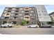 Attractive multi-story building featuring modern architecture and convenient street parking, nestled in a bustling city environment at 1898 S Bannock St # 202, Denver, CO 80223