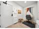Hallway office nook with a white storage cabinet, a modern writing desk, and neutral decor at 1898 S Bannock St # 202, Denver, CO 80223