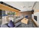 Stylish community lounge with comfortable seating, a modern fireplace, and large windows offering plenty of natural light at 1898 S Bannock St # 202, Denver, CO 80223