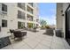 Inviting patio area with stylish seating, attractive plantings, and great natural light at 1898 S Bannock St # 202, Denver, CO 80223