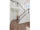 Bright foyer with hardwood floors, a staircase leading to the upper level, and neutral decor at 4975 S Zephyr St, Littleton, CO 80123