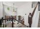 Open floor plan featuring a spacious living room connected to kitchen via stairs, and large windows at 4975 S Zephyr St, Littleton, CO 80123