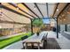 Outdoor dining area under pergola featuring string lights, a large table, and seating for backyard entertainment at 4975 S Zephyr St, Littleton, CO 80123