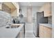 Modern kitchen featuring stainless steel appliances, stylish backsplash, and updated countertops at 5995 E Iliff Ave # 308, Denver, CO 80222