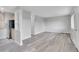 Open-concept living room with seamless integration to kitchen, ideal for entertaining, and modern flooring at 5995 E Iliff Ave # 308, Denver, CO 80222