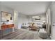 Bright living room with stylish decor, including modern furniture, artwork, and new floors at 5995 E Iliff Ave # 308, Denver, CO 80222