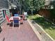 This backyard has a brick patio with furniture and grill and a swing set at 19688 E Lasalle Dr, Aurora, CO 80013