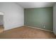This bedroom features neutral carpet, two-tone walls, and a standard closet, offering a cozy and functional space at 19688 E Lasalle Dr, Aurora, CO 80013
