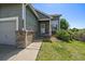 View of the front entrance featuring brick accents and well-maintained landscaping at 19688 E Lasalle Dr, Aurora, CO 80013