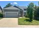 Charming single-Gathering home with an attached garage, well-maintained lawn and mature landscaping at 19688 E Lasalle Dr, Aurora, CO 80013