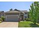 Charming single-Gathering home featuring a well-kept lawn, attached garage, and inviting brick accents at 19688 E Lasalle Dr, Aurora, CO 80013