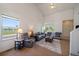 Spacious living room featuring vaulted ceilings, neutral decor and ample natural light at 19688 E Lasalle Dr, Aurora, CO 80013