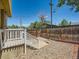 Enclosed backyard featuring a rock garden, stairs, white railing and a wood fence at 4418 W 11Th Ave, Denver, CO 80204