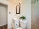 Bathroom featuring a light fixture, vanity, toilet, and a tiled shower at 4418 W 11Th Ave, Denver, CO 80204