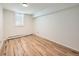 Spare bedroom featuring light wood floors, bright natural light and neutral paint at 4418 W 11Th Ave, Denver, CO 80204