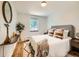 Serene bedroom with a cozy bed, stylish decor, and a large window for natural light at 4418 W 11Th Ave, Denver, CO 80204