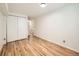 Spare bedroom featuring light wood floors and a closet at 4418 W 11Th Ave, Denver, CO 80204
