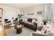 Cozy living room with a comfortable gray sofa, textured walls, and elegant decor for a relaxing atmosphere at 4418 W 11Th Ave, Denver, CO 80204