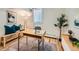 Home office featuring natural light, a desk, decorative accents, and a modern area rug at 4418 W 11Th Ave, Denver, CO 80204