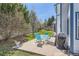 Landscaped backyard features a patio with an outdoor dining set and a grill at 9456 Bexley Dr, Highlands Ranch, CO 80126