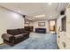 Finished basement features a comfortable seating area with wet bar, creating a cozy space at 9456 Bexley Dr, Highlands Ranch, CO 80126