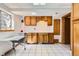 Basement utility area with tile floors and cabinetry, providing functionality at 9456 Bexley Dr, Highlands Ranch, CO 80126