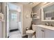 Well-lit half bathroom with neutral paint, laundry facilities, and decorative touches create a welcoming space at 9456 Bexley Dr, Highlands Ranch, CO 80126