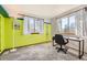 Bright bedroom featuring a dedicated desk space, and two large windows that let in tons of natural light at 9456 Bexley Dr, Highlands Ranch, CO 80126