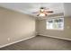 Finished basement with window and ceiling fan at 21787 Unbridled Ave, Parker, CO 80138