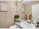 Clean bathroom with a vanity and a large mirror at 21787 Unbridled Ave, Parker, CO 80138