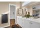 Elegant bathroom with double vanity and walk-in closet at 21787 Unbridled Ave, Parker, CO 80138