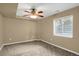 Bright bedroom featuring a window with blinds and ceiling fan at 21787 Unbridled Ave, Parker, CO 80138