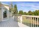 Deck overlooks a backyard with trees and playset at 21787 Unbridled Ave, Parker, CO 80138