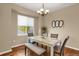 Dining room with hardwood floors, marble table and bench seating at 21787 Unbridled Ave, Parker, CO 80138