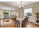 Bright dining room features hardwood floors and a spacious layout at 21787 Unbridled Ave, Parker, CO 80138