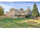 Two-story house with a deck and stairs in the backyard at 21787 Unbridled Ave, Parker, CO 80138