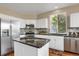 Modern kitchen with stainless steel appliances and granite countertops at 21787 Unbridled Ave, Parker, CO 80138