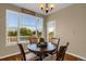 Bright kitchen nook with a view of the backyard at 21787 Unbridled Ave, Parker, CO 80138