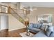 Two story living room with hardwood floors, fireplace and staircase at 21787 Unbridled Ave, Parker, CO 80138